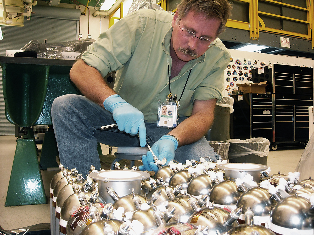 Dave Parker disassembles battery modules after their return from a  Hubble Space Telescope servicing mission